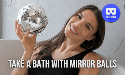 Stunningly beautiful girl takes a bath of mirror balls Stunningly beautiful girl takes a bath of mirror balls